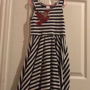 I am selling a summer dress with a bird on it